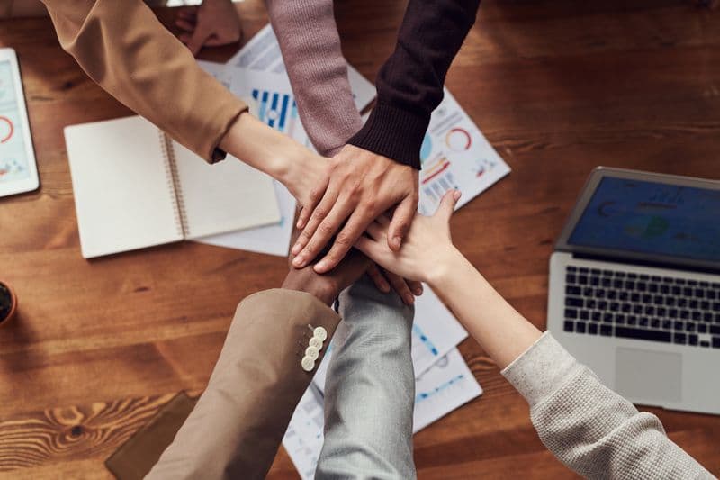 Diverse team welcoming clients